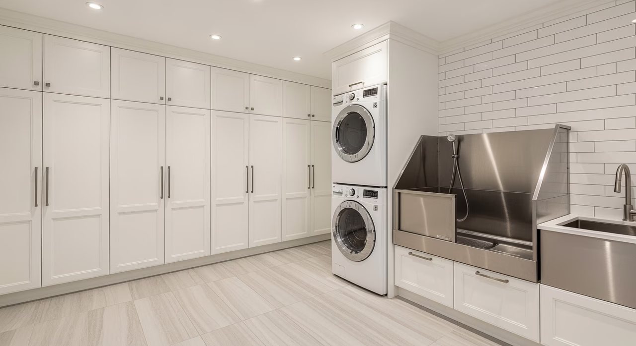 Completed Toronto mudroom-plus-laundry combo with stacked LG washer-dryer and dog wash station