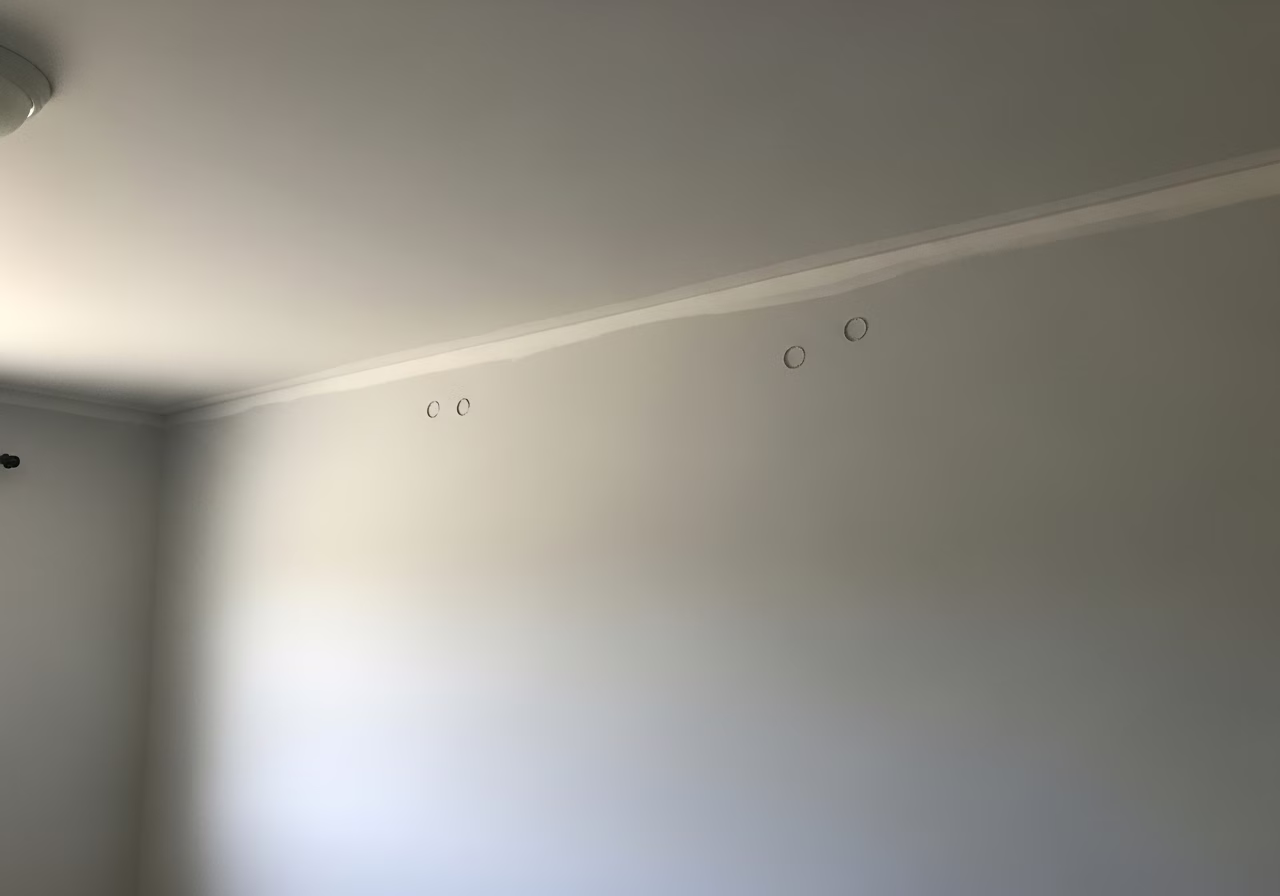Multiple nail pops on Vaughan home master bedroom ceiling seam — common post-2000 build issue